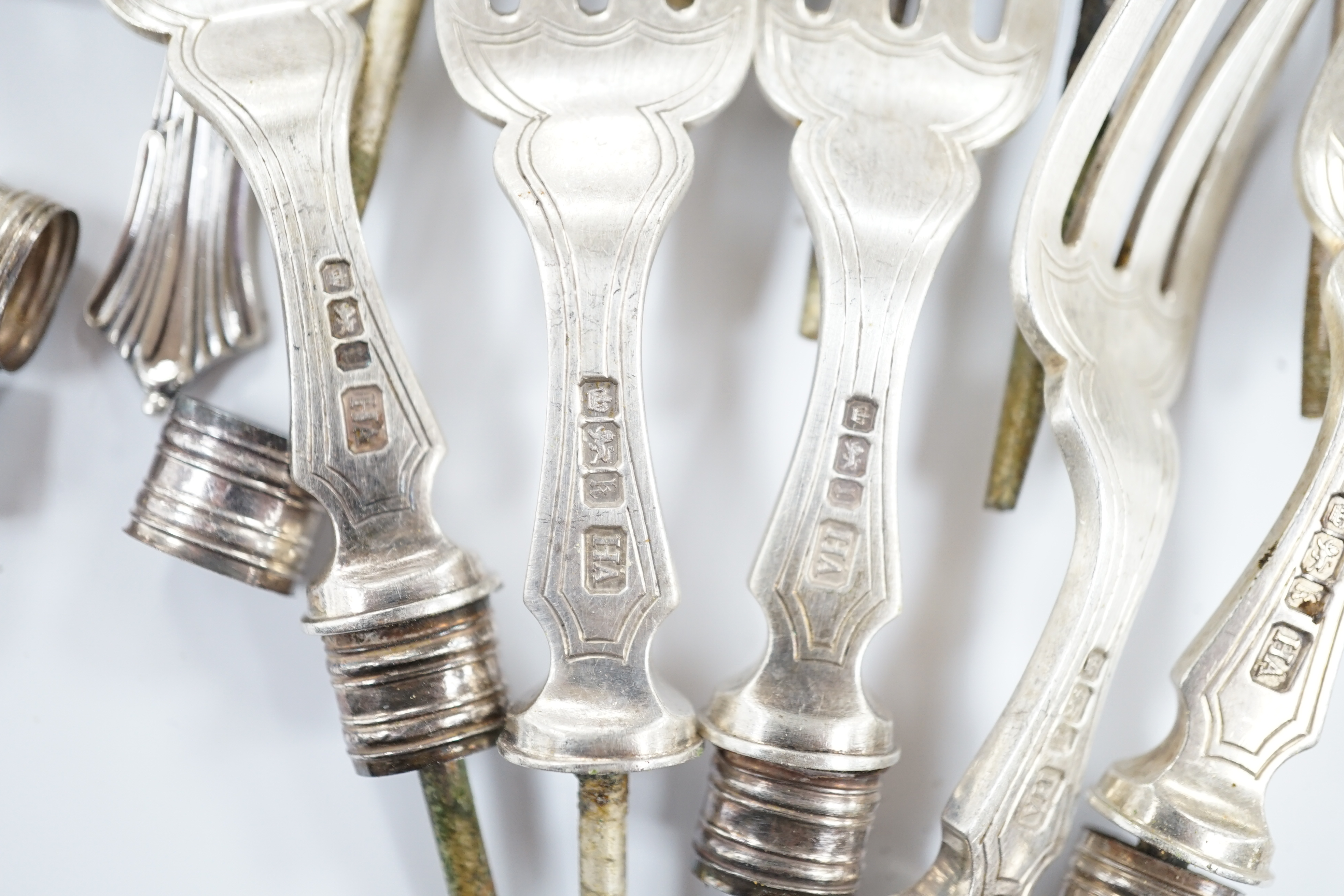 A pair of George IV silver fiddle pattern table spoons, William Bateman, London, 1824, six other later silver items of flatware, 7.5oz, together with six silver knife blades and five set of silver fork tines, gross 11.8o